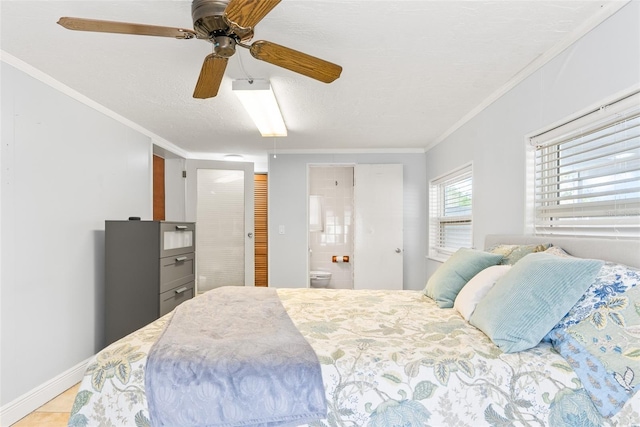 bedroom featuring light tile patterned flooring, connected bathroom, a ceiling fan, baseboards, and crown molding