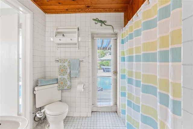 full bath with toilet, wooden ceiling, tile patterned flooring, and tile walls