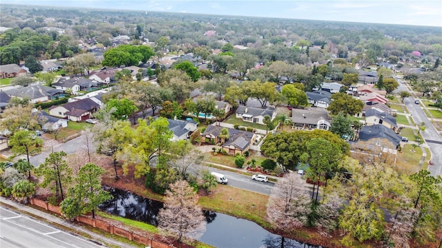 birds eye view of property featuring a residential view and a water view