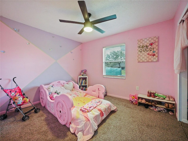 bedroom featuring a textured ceiling, carpet flooring, a ceiling fan, baseboards, and vaulted ceiling