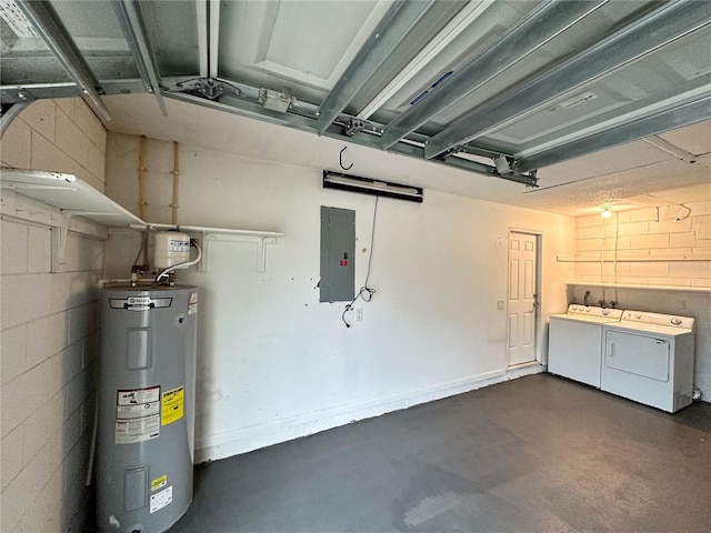 garage with water heater, washing machine and dryer, electric panel, and concrete block wall