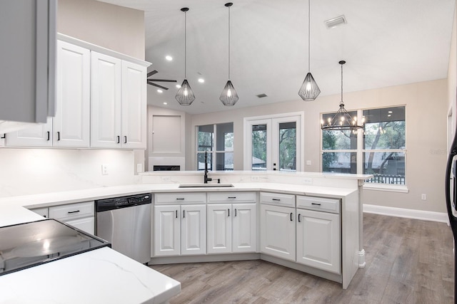 kitchen featuring a sink, visible vents, white cabinets, dishwasher, and pendant lighting