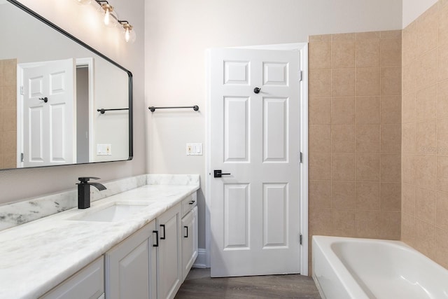 bathroom with vanity and wood finished floors