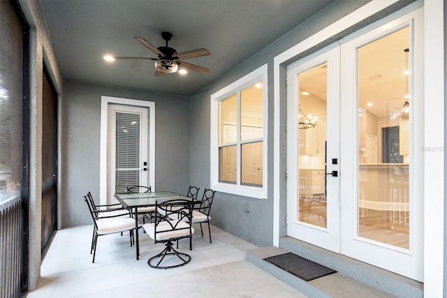 sunroom with ceiling fan and french doors