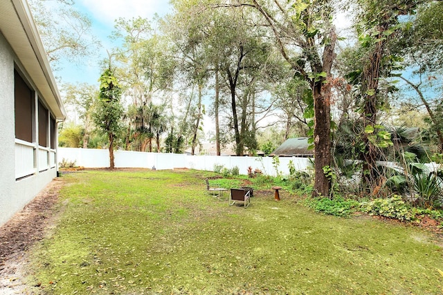 view of yard with a fenced backyard