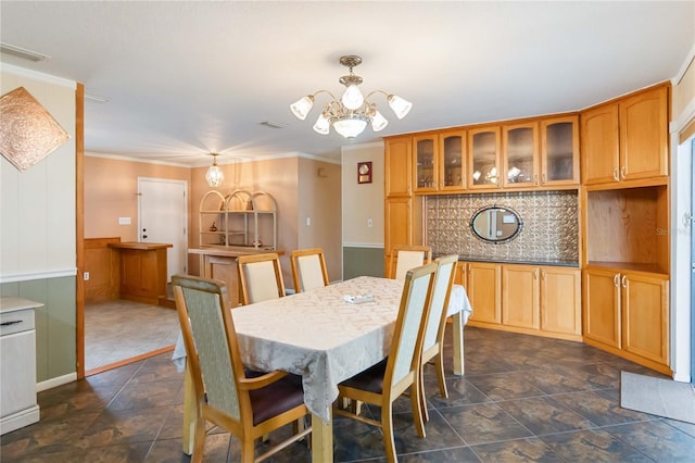 dining space featuring a chandelier, visible vents, and crown molding