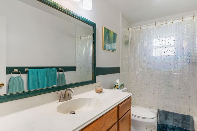 bathroom with a shower with curtain, vanity, and toilet