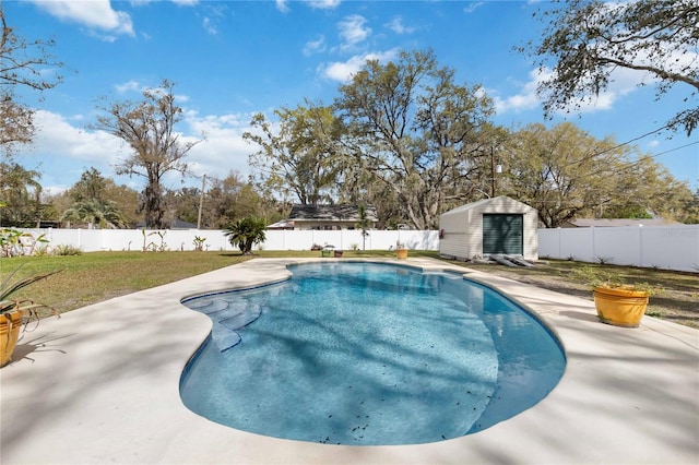 view of pool with a fenced backyard, an outdoor structure, a fenced in pool, a storage unit, and a patio area