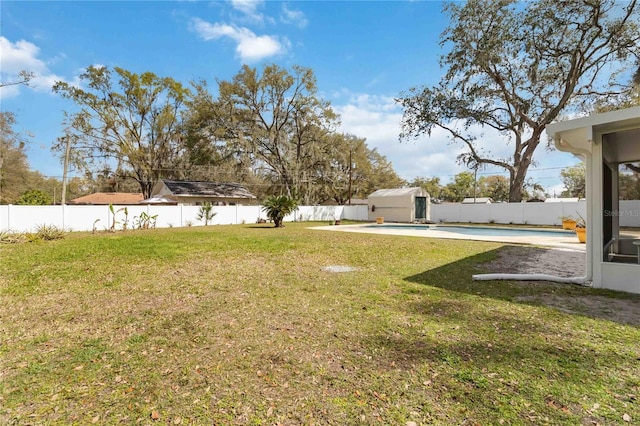 view of yard with a fenced in pool and a fenced backyard