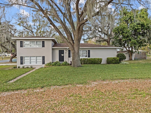 split level home with a front yard