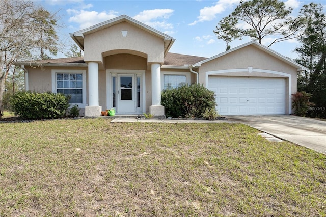 view of front of house with driveway, a front lawn, an attached garage, and stucco siding