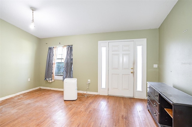 entryway featuring light wood-style flooring and baseboards