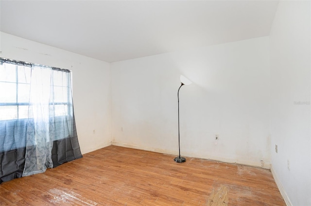 unfurnished room with light wood-type flooring