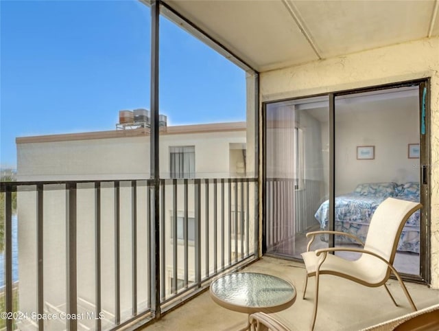 balcony featuring a water view