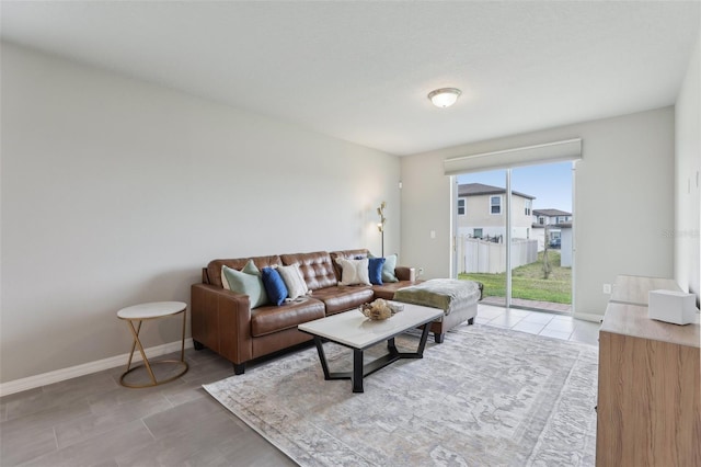 tiled living area with baseboards