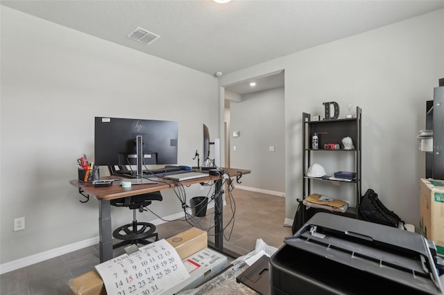 home office featuring visible vents and baseboards