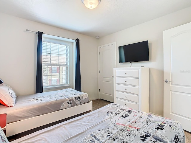 bedroom featuring light wood-style flooring