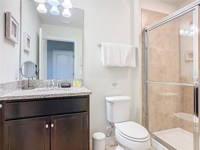 full bath featuring visible vents, a shower stall, toilet, and vanity