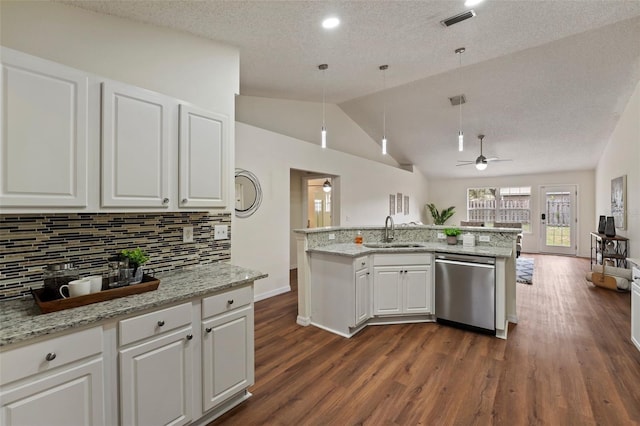 kitchen with light stone counters, white cabinetry, a sink, and stainless steel dishwasher