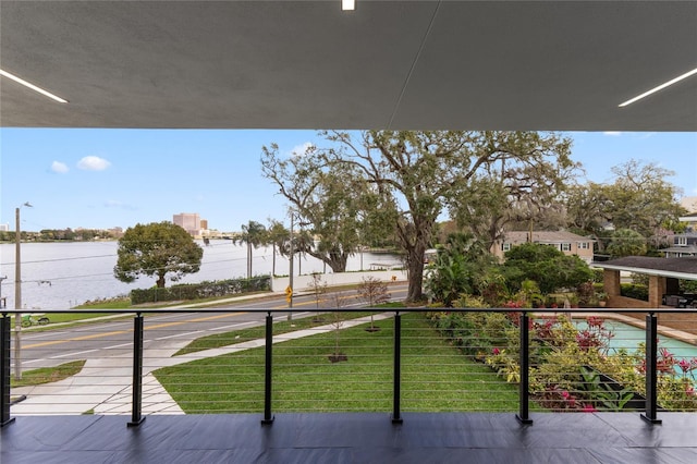 balcony featuring a water view