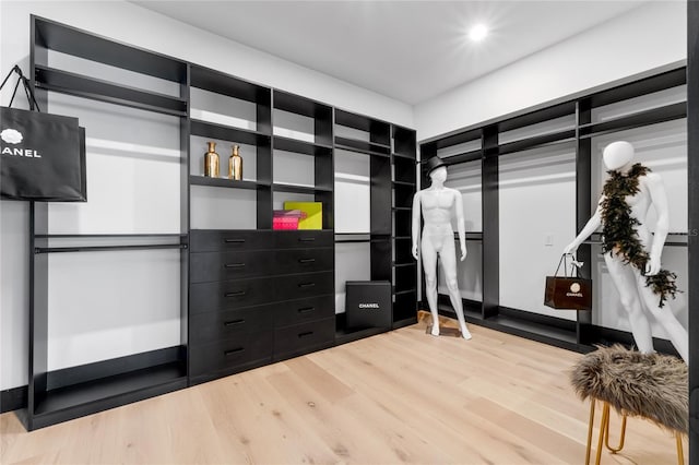 spacious closet featuring wood finished floors