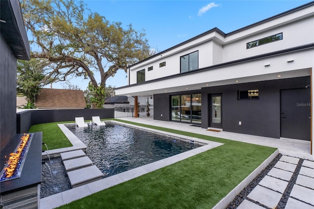 view of pool featuring a yard, a fenced in pool, a fenced backyard, and a patio