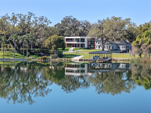 exterior space featuring a water view and a lawn