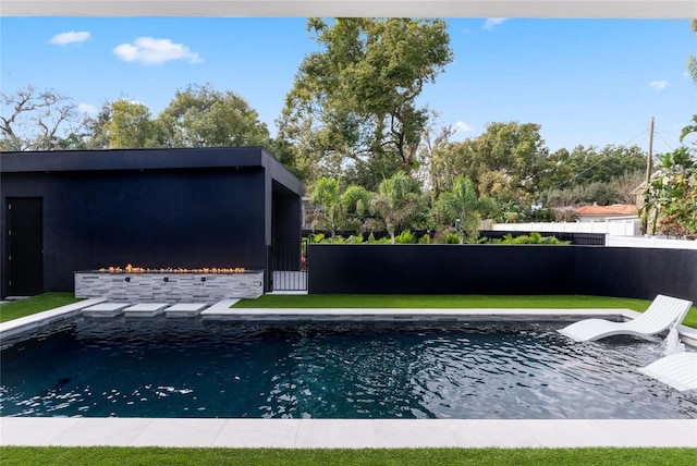 view of swimming pool with fence and a fenced in pool