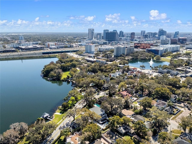 birds eye view of property featuring a view of city and a water view