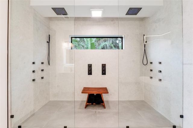 bathroom with visible vents and walk in shower