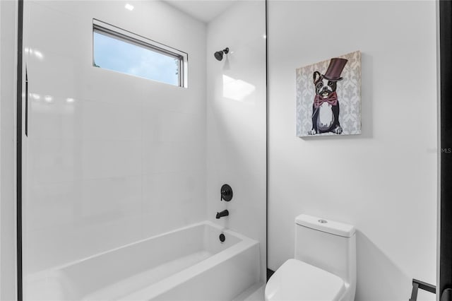 full bathroom featuring washtub / shower combination and toilet