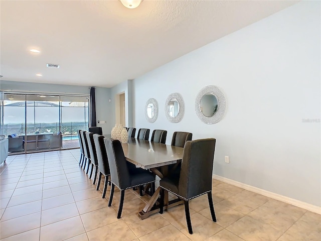 dining room with light tile patterned floors, recessed lighting, visible vents, and baseboards