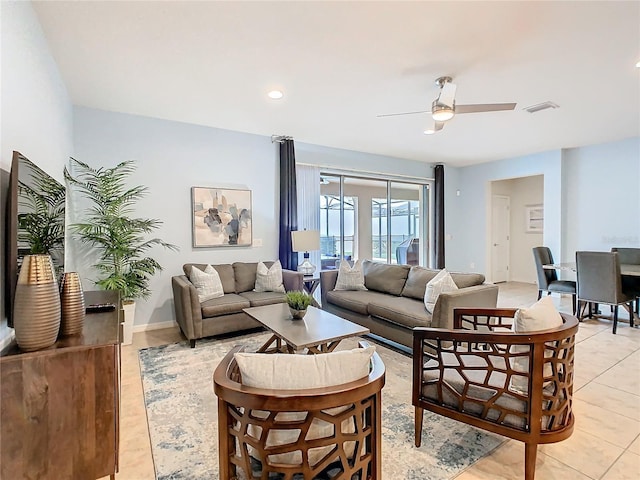 living room featuring light tile patterned floors, visible vents, baseboards, ceiling fan, and recessed lighting