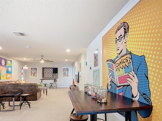 carpeted dining area featuring baseboards, recessed lighting, visible vents, and a ceiling fan