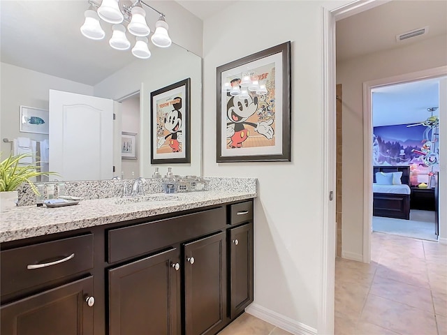 ensuite bathroom with visible vents, ensuite bathroom, vanity, a chandelier, and baseboards