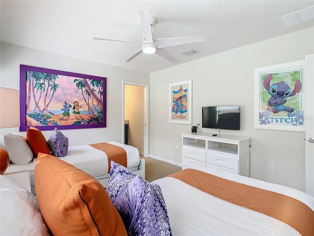 bedroom featuring a ceiling fan, visible vents, and baseboards