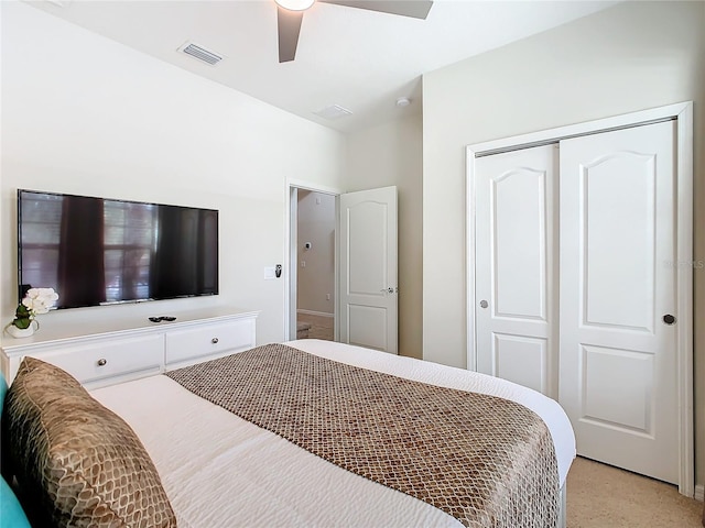 bedroom with ceiling fan, a closet, and visible vents