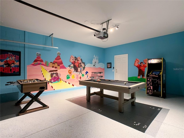 playroom featuring a garage and speckled floor