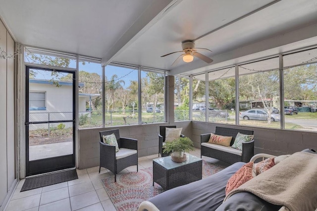 sunroom / solarium featuring a wealth of natural light and ceiling fan