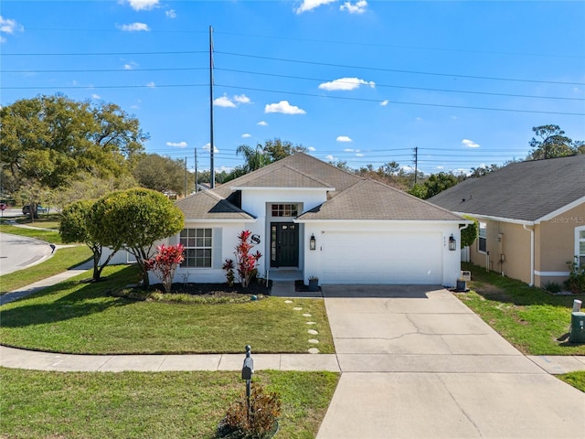 ranch-style home featuring a garage, a shingled roof, concrete driveway, stucco siding, and a front yard