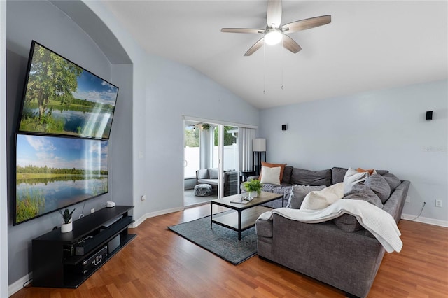 living area with lofted ceiling, baseboards, a ceiling fan, and wood finished floors