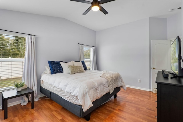 bedroom featuring vaulted ceiling, ceiling fan, wood finished floors, and baseboards