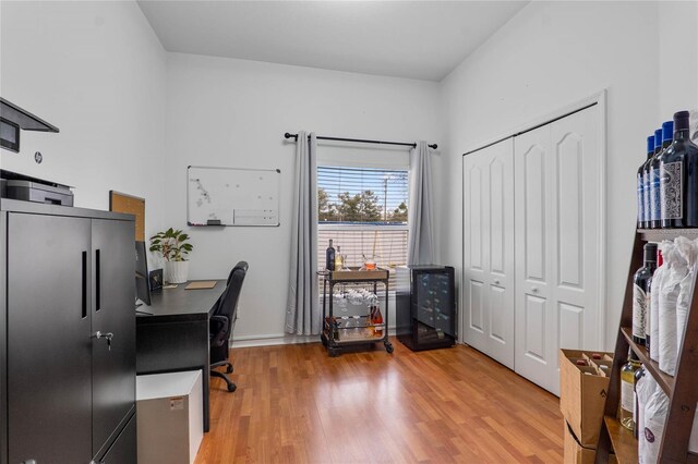 home office with light wood-style flooring