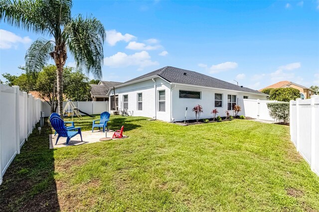 239 Bronze Leaf Ct, Apopka, FL 32703 - back of house with a patio, a gate, roof with shingles, and stucco siding