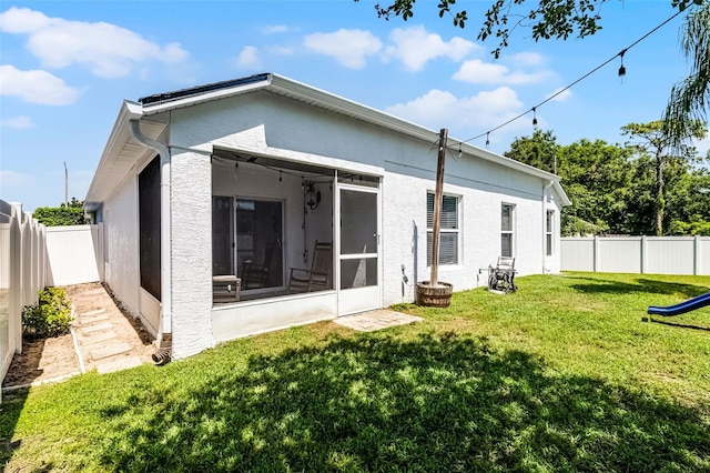 239 Bronze Leaf Ct, Apopka, FL 32703 - rear view of property featuring a sunroom and stucco siding