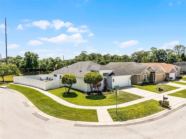 239 Bronze Leaf Ct, Apopka, FL 32703 - view of front facade with a garage, driveway, a shingled roof, and stucco siding