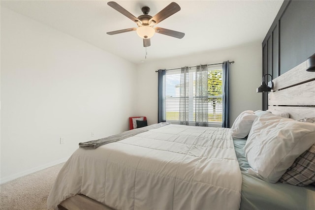 bedroom with carpet, baseboards, and ceiling fan