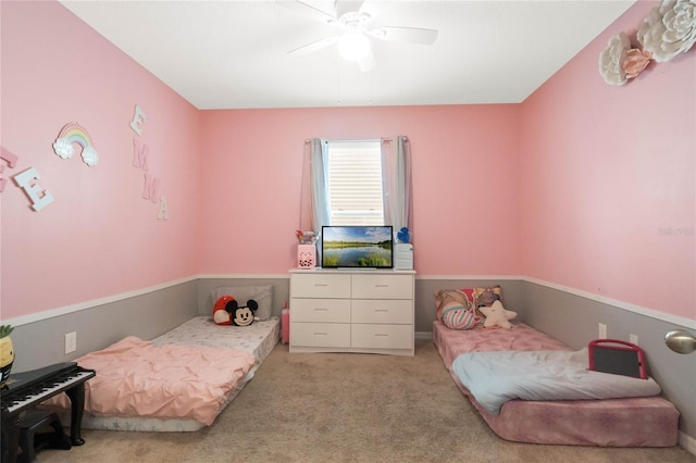 bedroom featuring a ceiling fan and light colored carpet