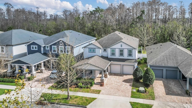 view of front facade with a residential view and decorative driveway