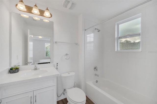 full bathroom featuring visible vents, vanity, toilet, and shower / bathtub combination